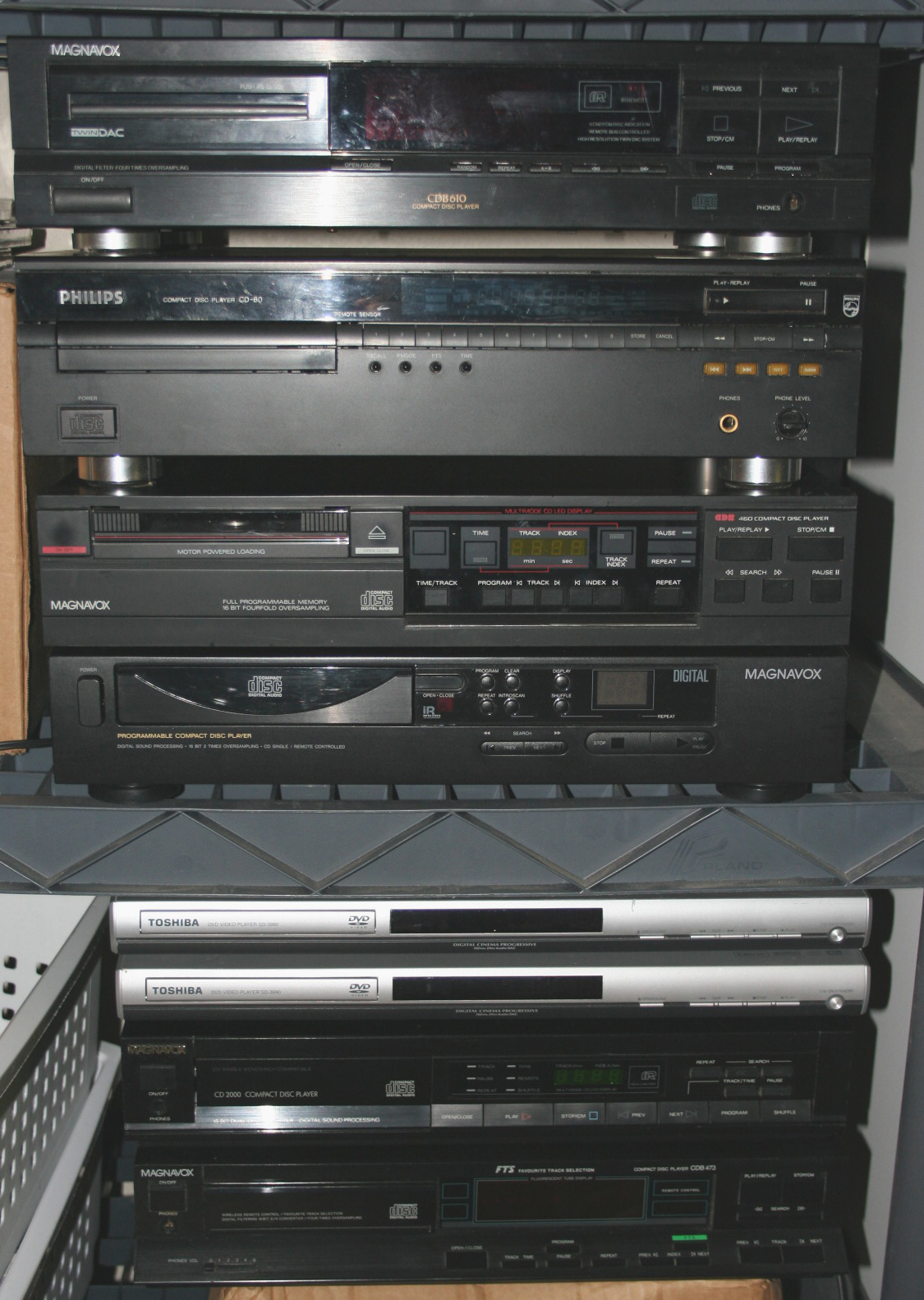 80s-era Philips-based CD players; two 2006 Toshiba SD-3990 CD/DVD players.